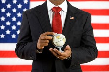 Politician Holding Globe [Image © seanlockephotography - Fotolia.com]